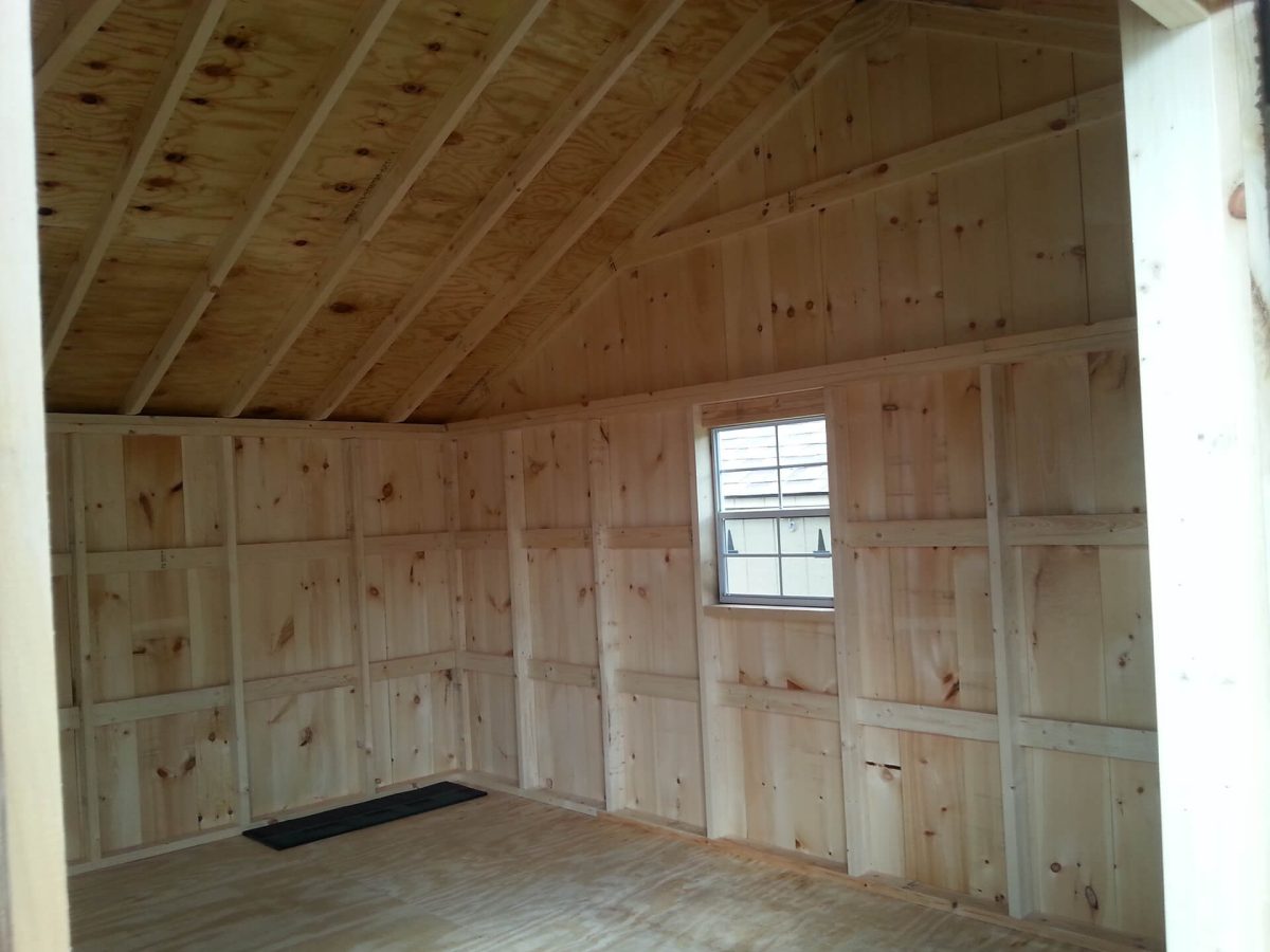 board and batten shed with wood doors