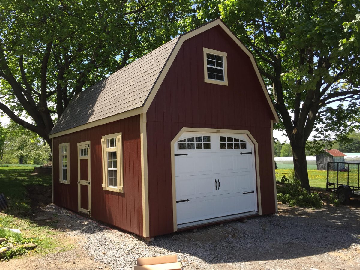 red two story storage shed garage