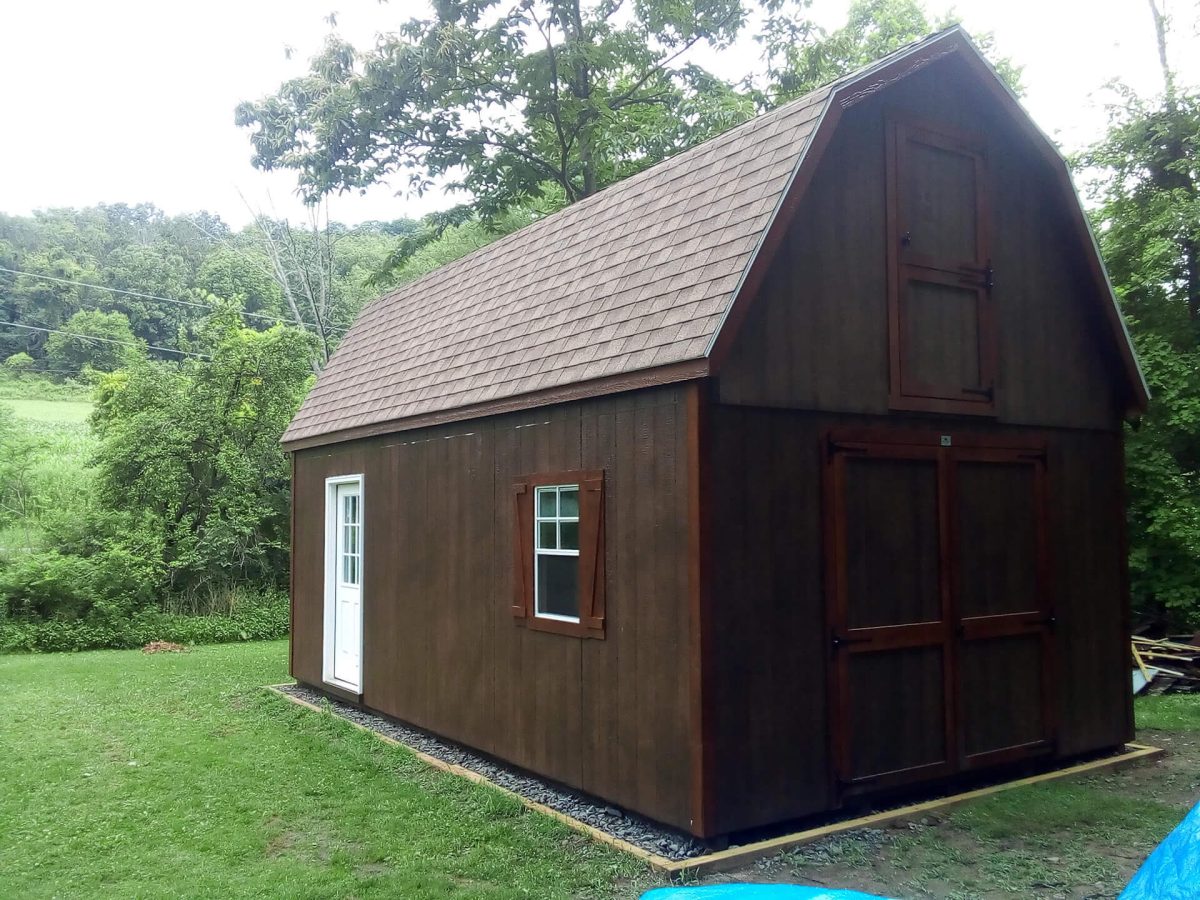 large shed with shingled roof