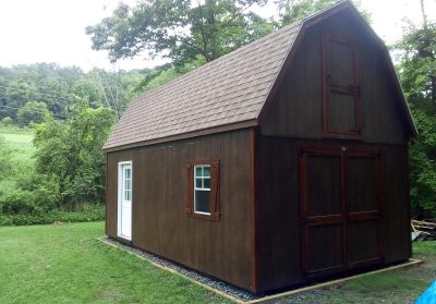 large shed with shingled roof
