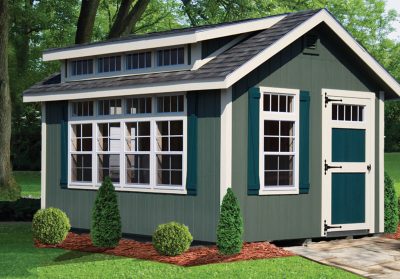 green custom shed with dormer