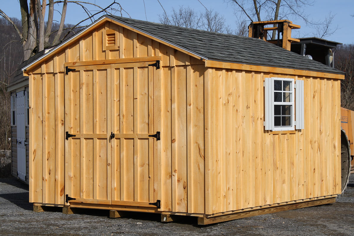 stained wooden shed